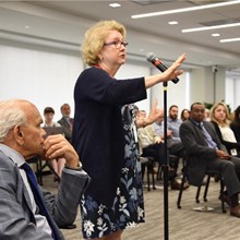 An audience member dialogues with Dr. Arno K. Kumagai during the Baldwin Seminar held June 26, 2019